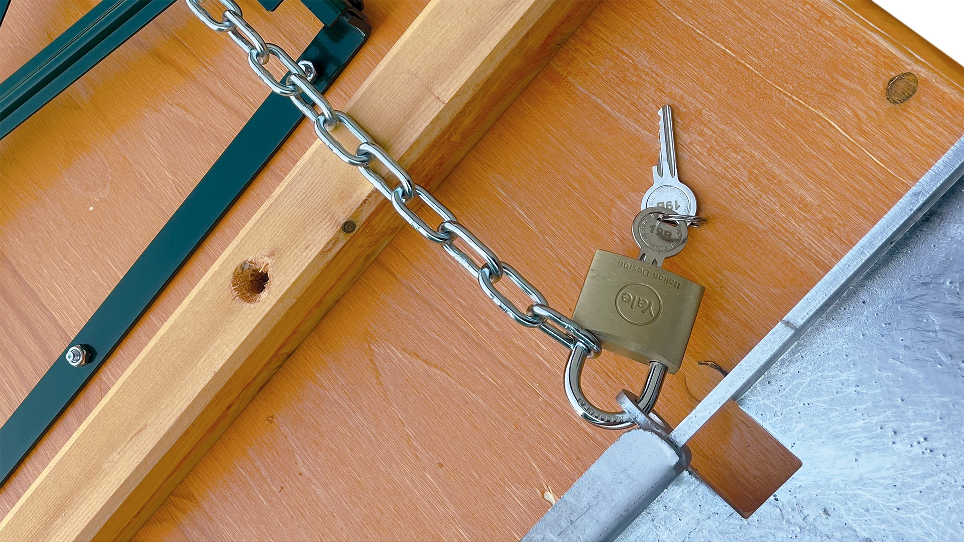 Close-up of the padlock of the locking chain for transport containers for beer tent sets